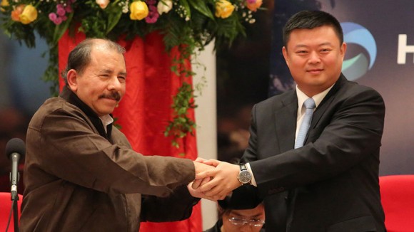 Nicaraguan President Daniel Ortega and Chinese tycoon Wang Jing on Saturday said plans to start building a $40-billion canal across the Central American country were on track for late 2014. Wang Jing's Beijing Interoceanic Canal Investment Management Co. has secured the right to dig a waterway in Nicaragua that will rival the Panama Canal and be hugely significant to world trade if it is completed. AFP PHOTO/ Inti OCON